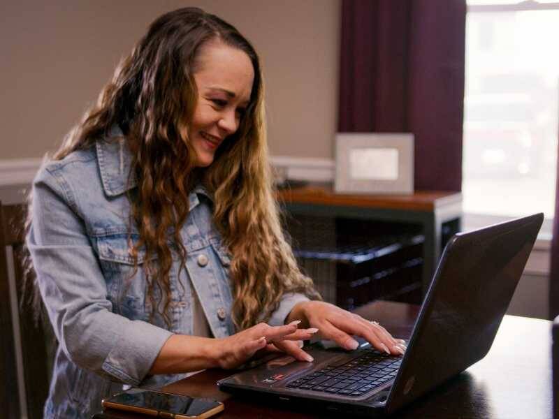 woman working on her laptop at a desk