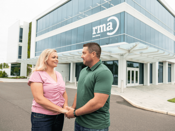 rma new jersey fertility clinic patients outside holding hands